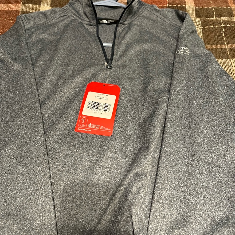 Women’s Grey quarter zip North face shirt. Size L